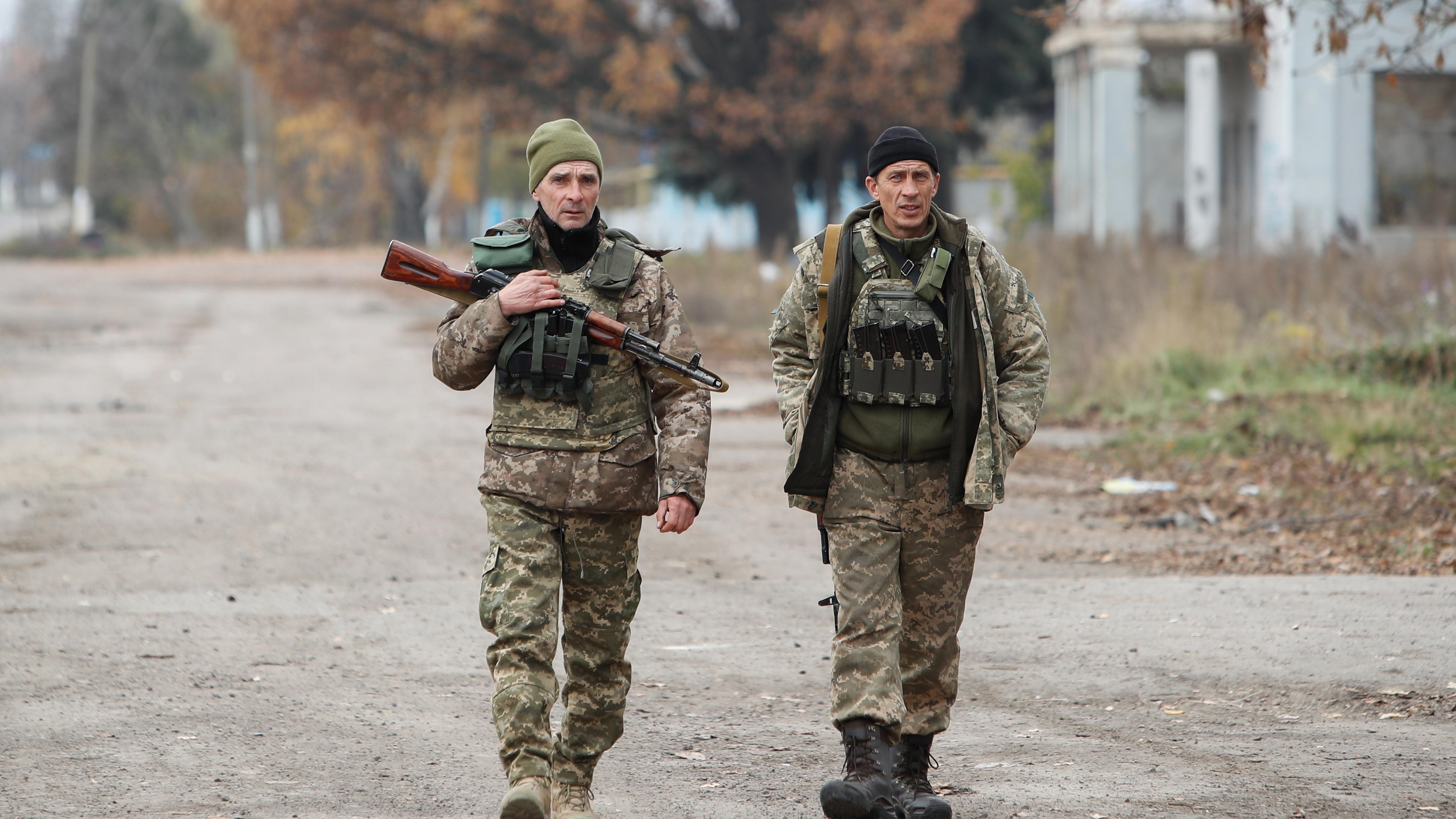 Kherson November 8, 2022, Two Ukrainian soldiers patrol a town in the Kherson region