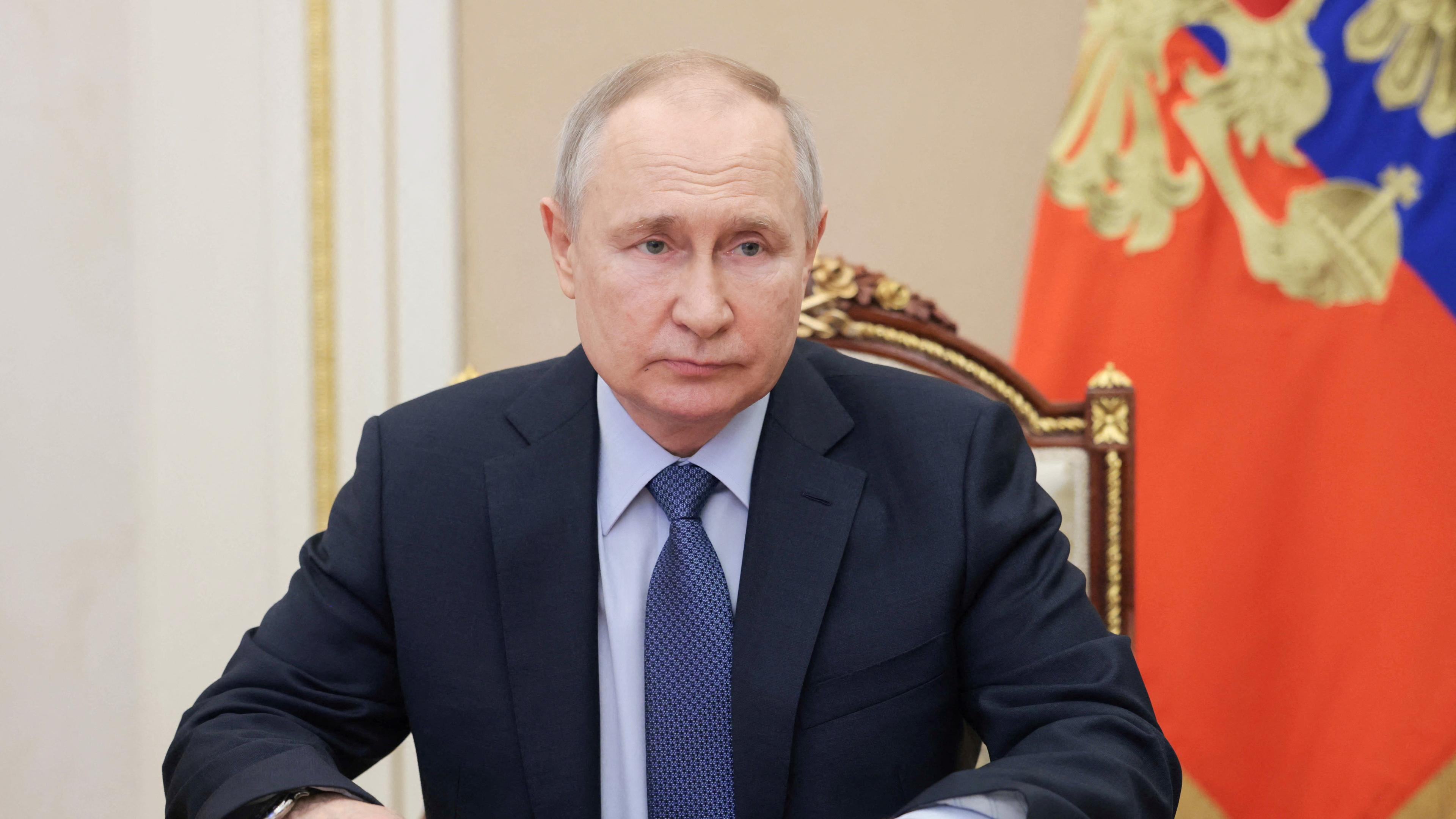 Moscow, March 17, 2023: Russian President Vladimir Putin sits at his desk during a video conference.