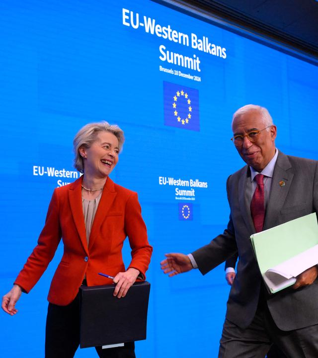 The President of the European Commission Ursula von der Leyen (L) and European Council President Antonio Costa leave after a press conference during the EU-Western Balkans summit at the European Council in Brussels