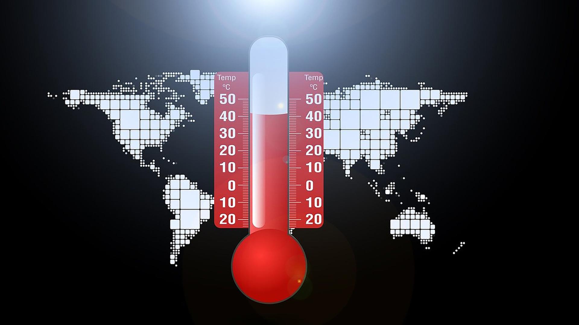 Thermometer über einer Weltkarte