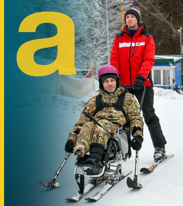 Ein ukrainischer Kriegsveteran fährt zusammen mit seinem Skilehrer Tellerlift