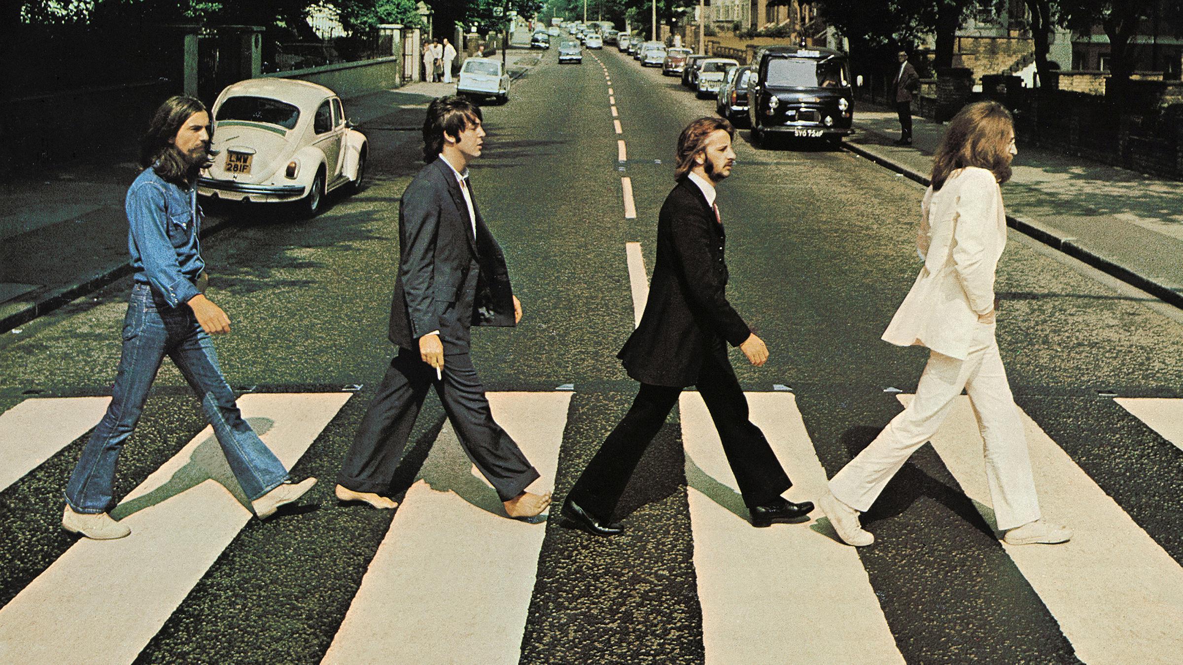 Das Bild zeigt das Beatles-Album-Cover mit dem "Abbey Road"-Zebrastreifen.