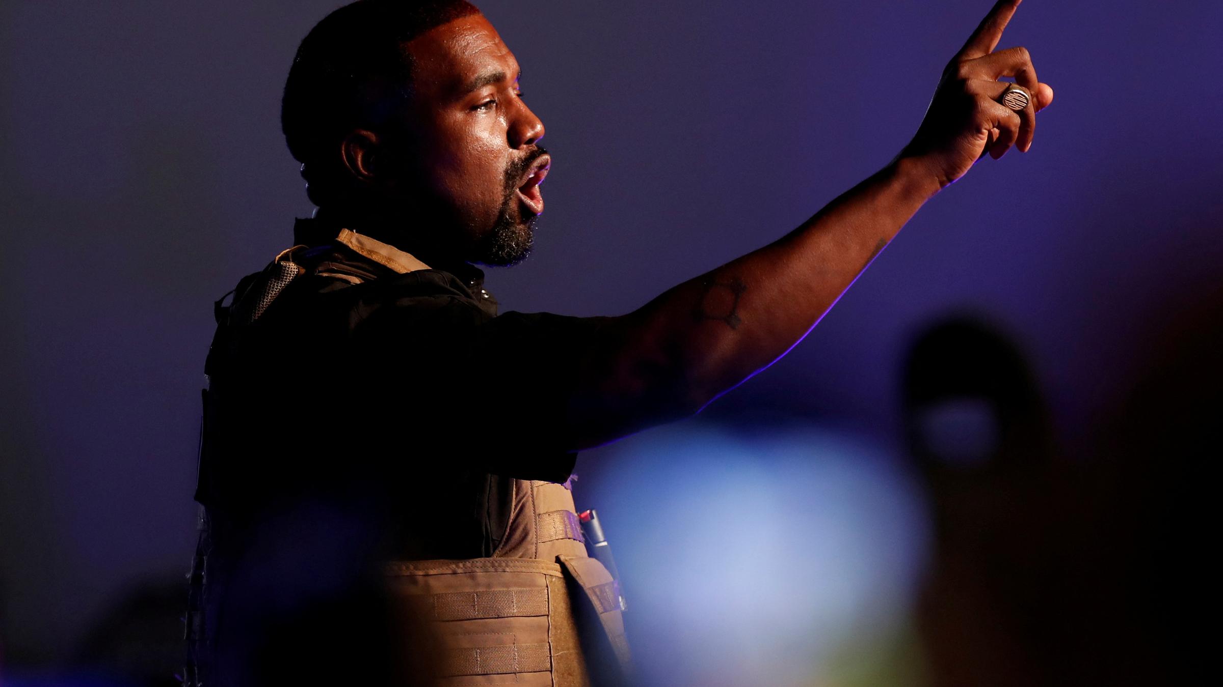 FILE PHOTO: Rapper Kanye West gestures to the crowd as he holds his first rally in support of his presidential bid in North Char