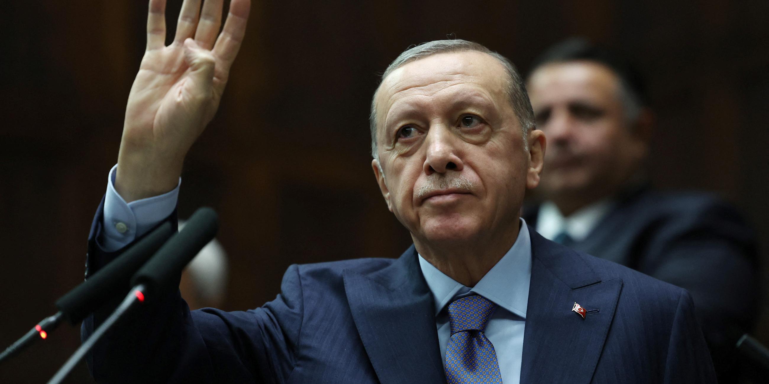 Turkey's President Tayyip Erdogan greets members of parliament in Ankara