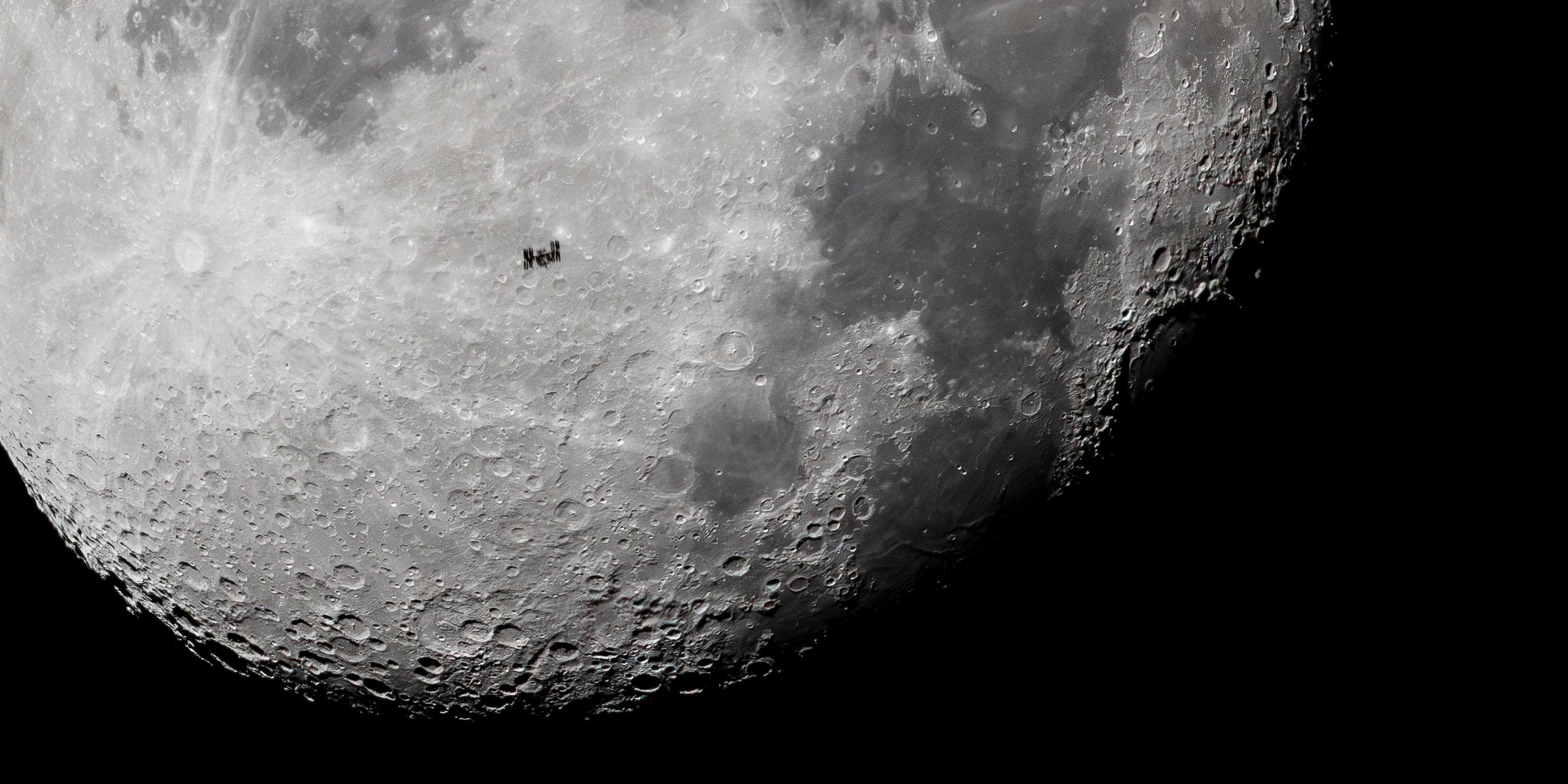 International Space Station (ISS) passes in front of the Moon