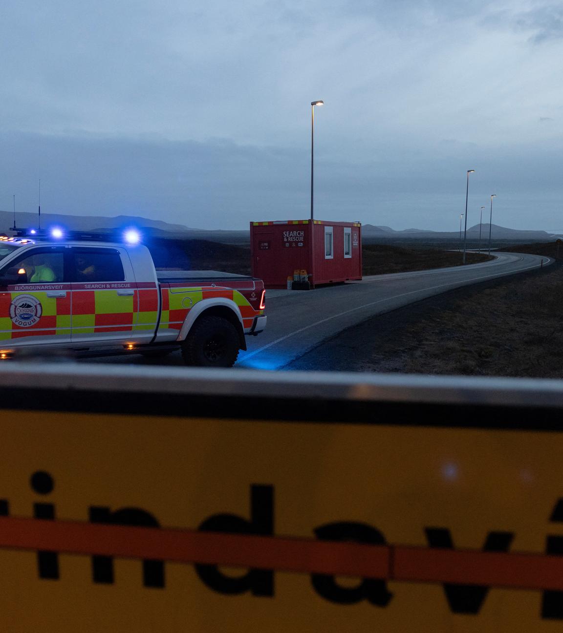 Police blocks a road leading to the village of Grindavik, which was evacuated due to volcanic activity