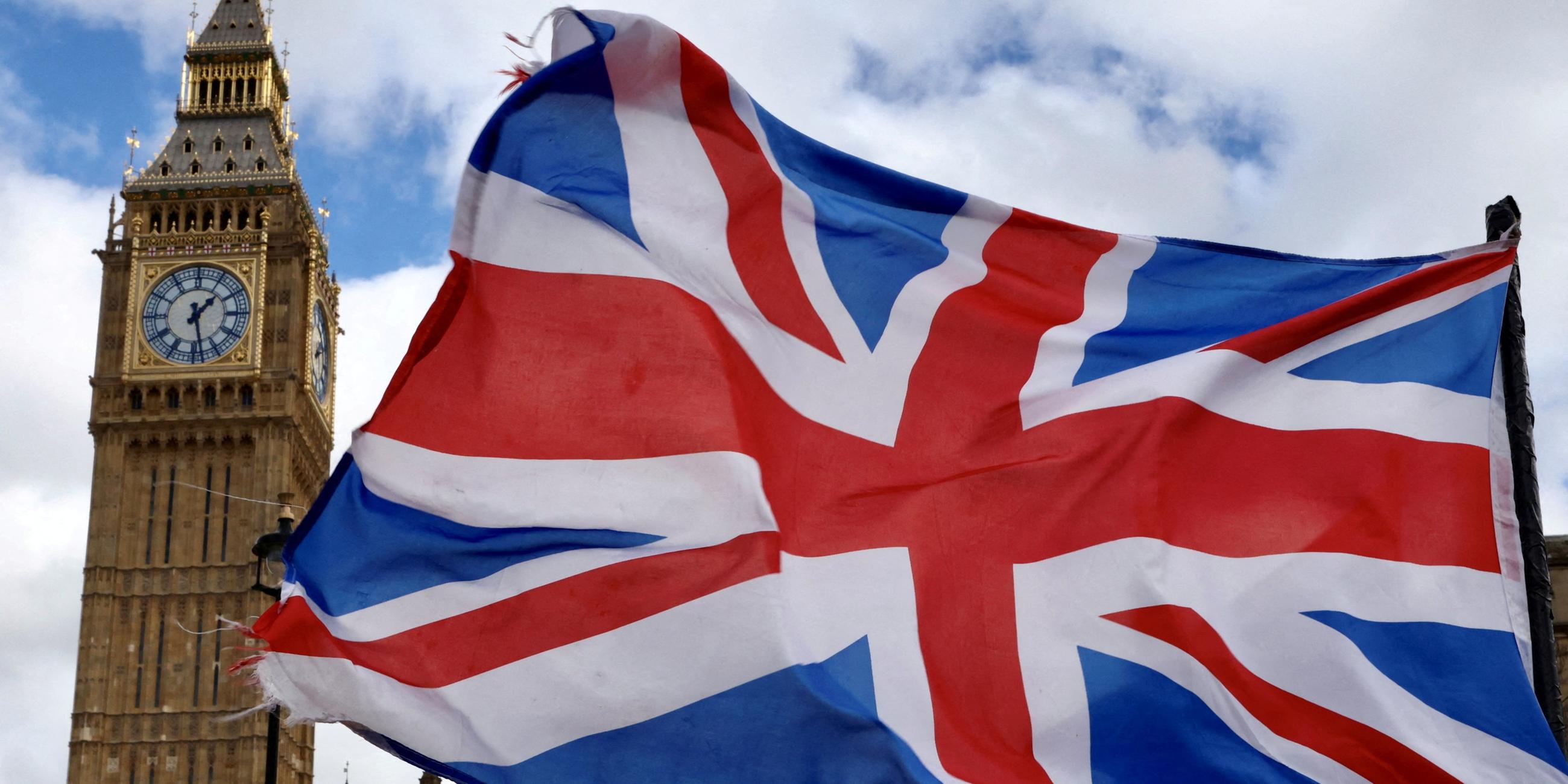 FILE PHOTO: A Union Jack flag flutters in the wind near Big Ben and Parliament in Parliament Square in London