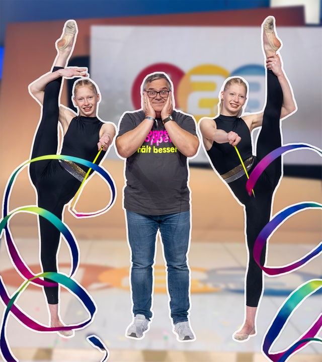 Elton steht zwischen den Zwillingen Nadiia und Veronika