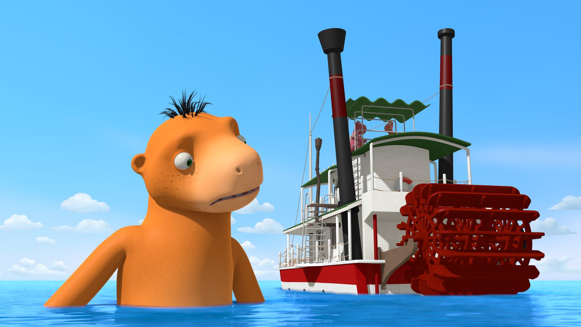 Der Wasserdrache Amadeus streckt seinen Kopf aus dem Wasser und guckt von oben aufs Chef's Boot.