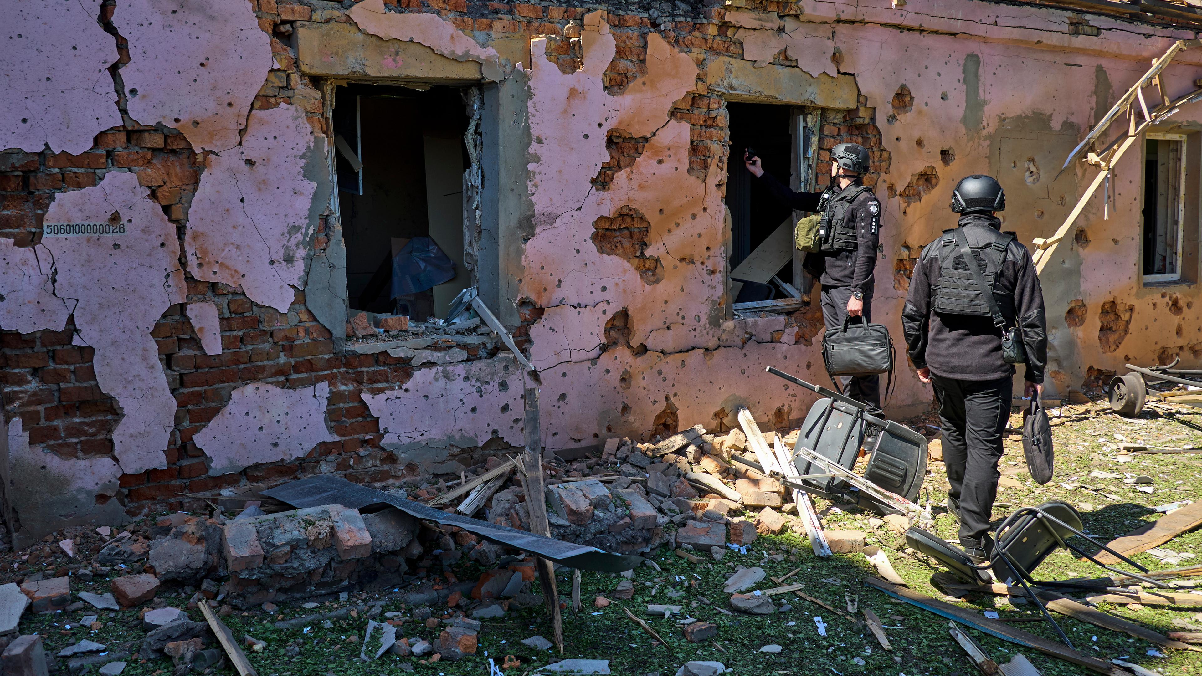 Ukrainian experts work at the site of a glide bomb attack on civil infrastructure objects in Kharkiv, Ukraine, 30 April 2024, amid the Russian invasion