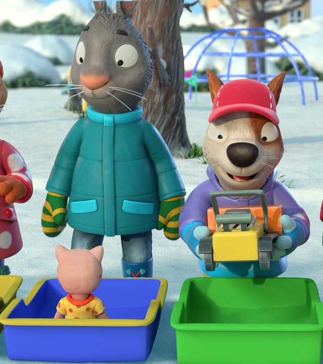 Posy, Pip, Zac und Jamila stehen draußen vor bunten Kisten. Froschi und Schweinchen sitzen vor Posy und Pip, Zac ist gerade dabei, seinen Bagger in die Kiste zu legen.