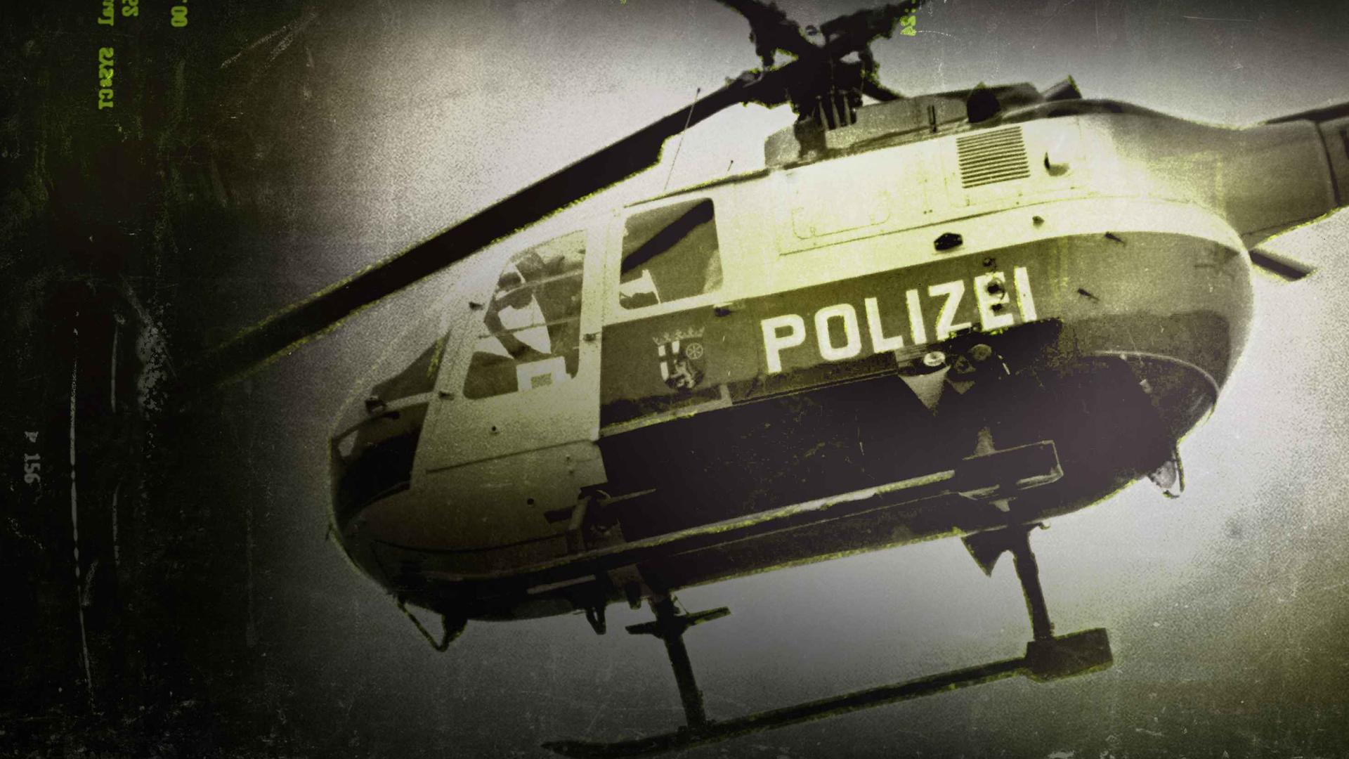 Ein Polizeihubschrauber, das Bild ist gelblich gehalten
