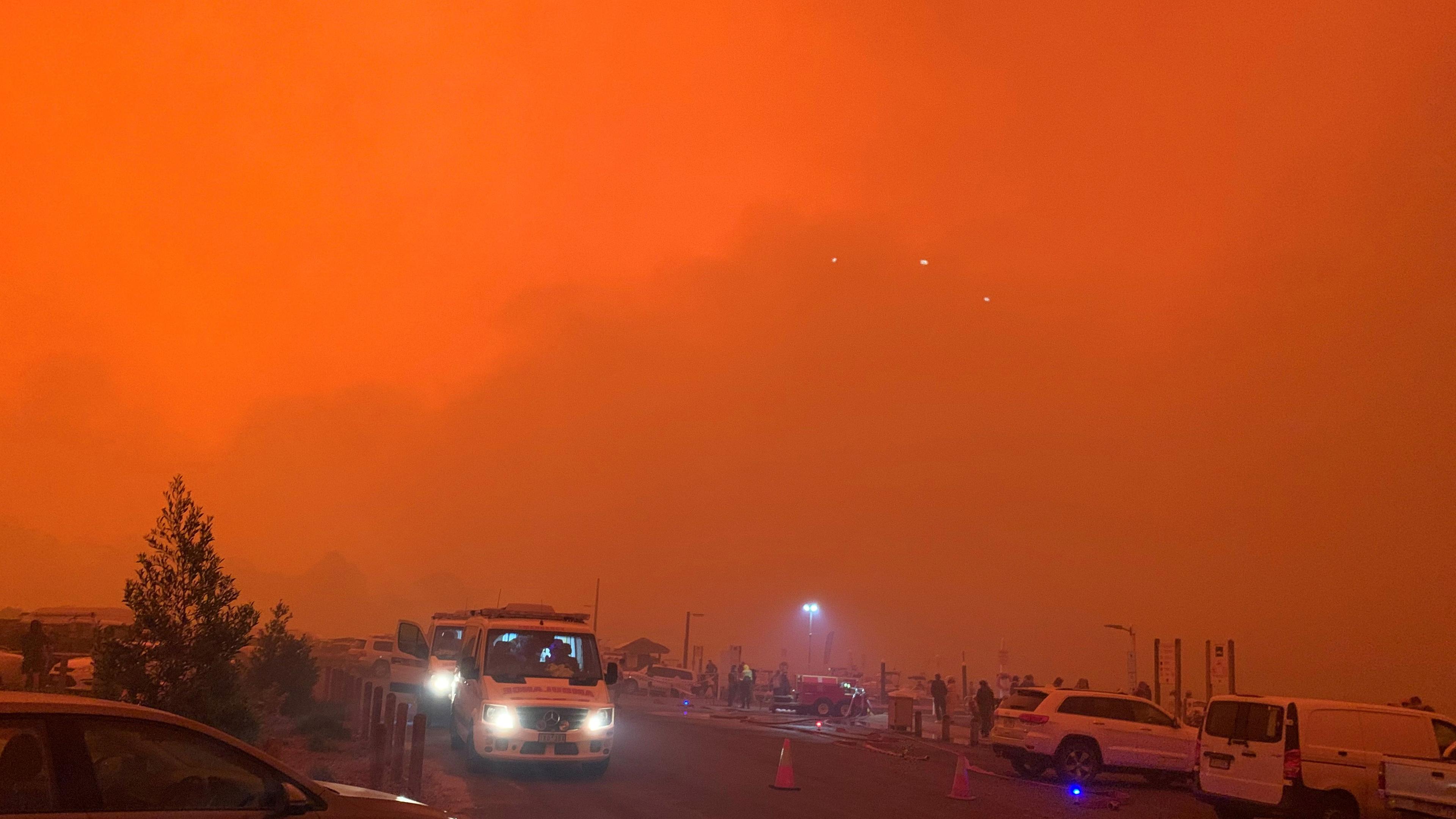 the sky glows red as bushfires continue to rage in mallacoota, victoria, australia