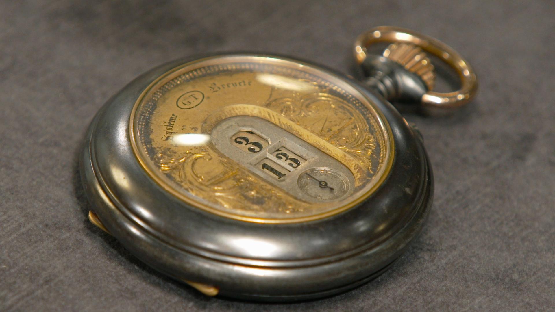 Antike, silber-goldene Taschenuhr.