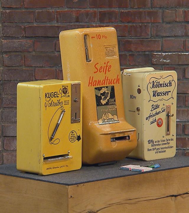 Drei Münzwarenautomaten