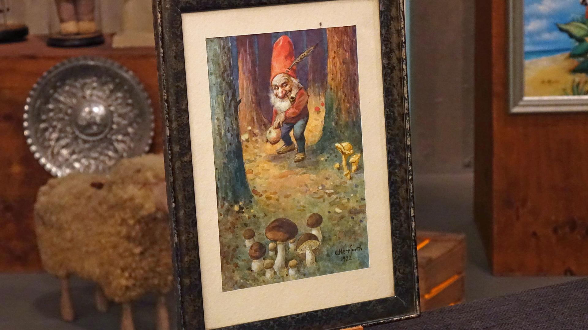 Aquarell von Oskar Herrfurth. Dargestellt ist ein Zwerg mit roter Mütze und Pfeife, der im Wald Steinpilze findet.