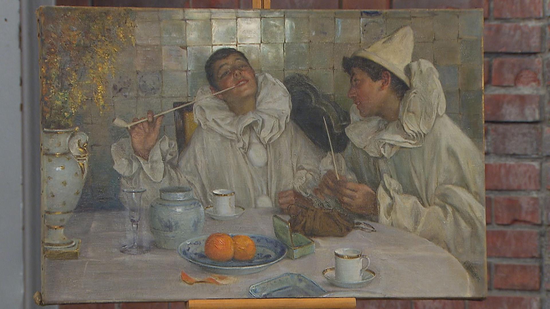 Gemälde von Paul Hoecker: Dargestellt sind zwei Harlekine, die fröhlich bei einem Gastmahl sitzen