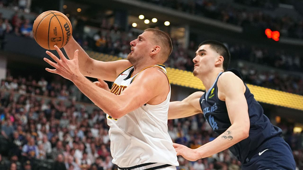 Nikola Jokic in action against Zach Edey