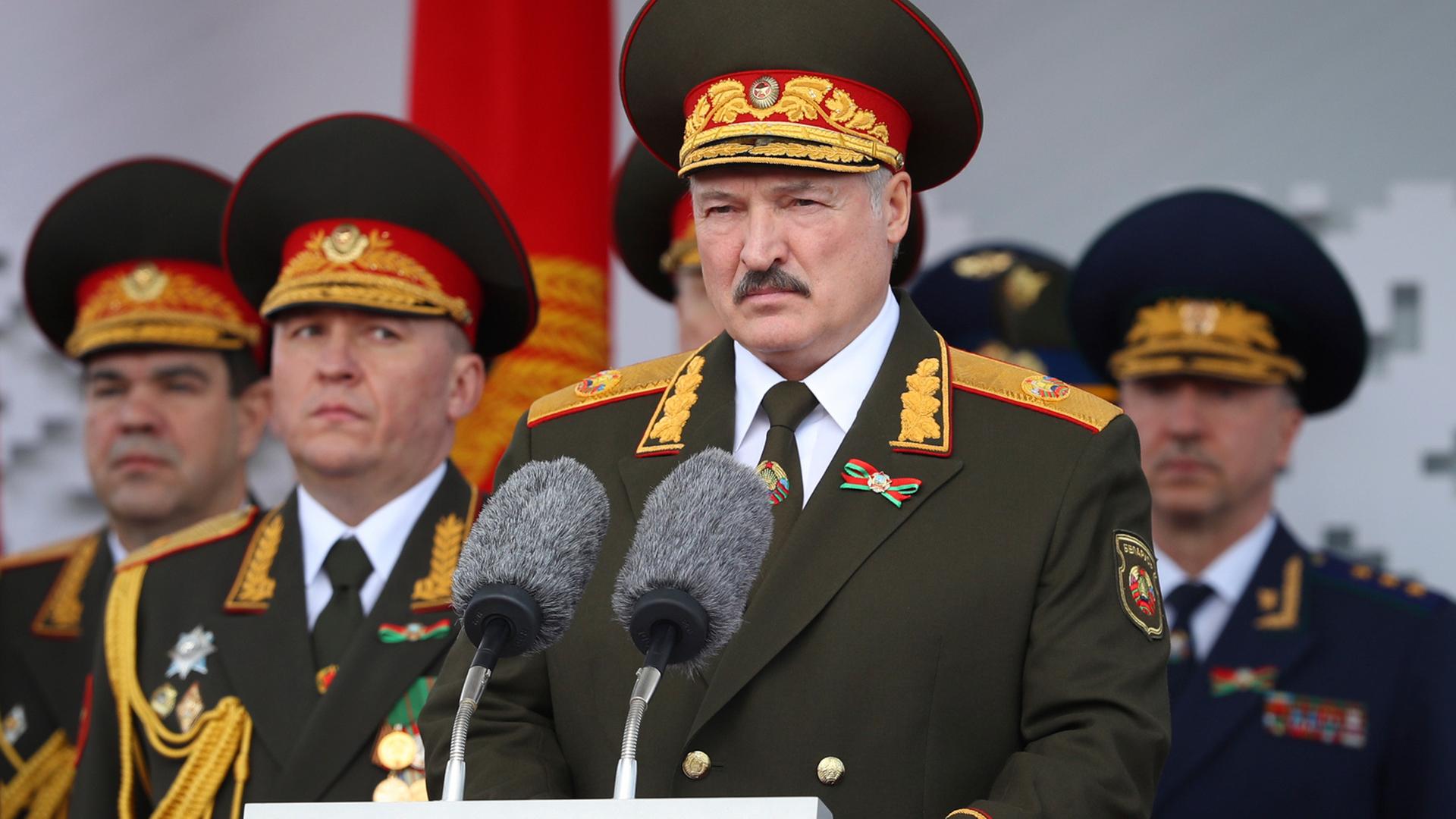 Belarusian President Alexander Lukashenko, center, gives a speech during a military parade that marked the 75th anniversary of the allied victory over Nazi Germany, in Minsk, Belarus, on May 9, 2020.