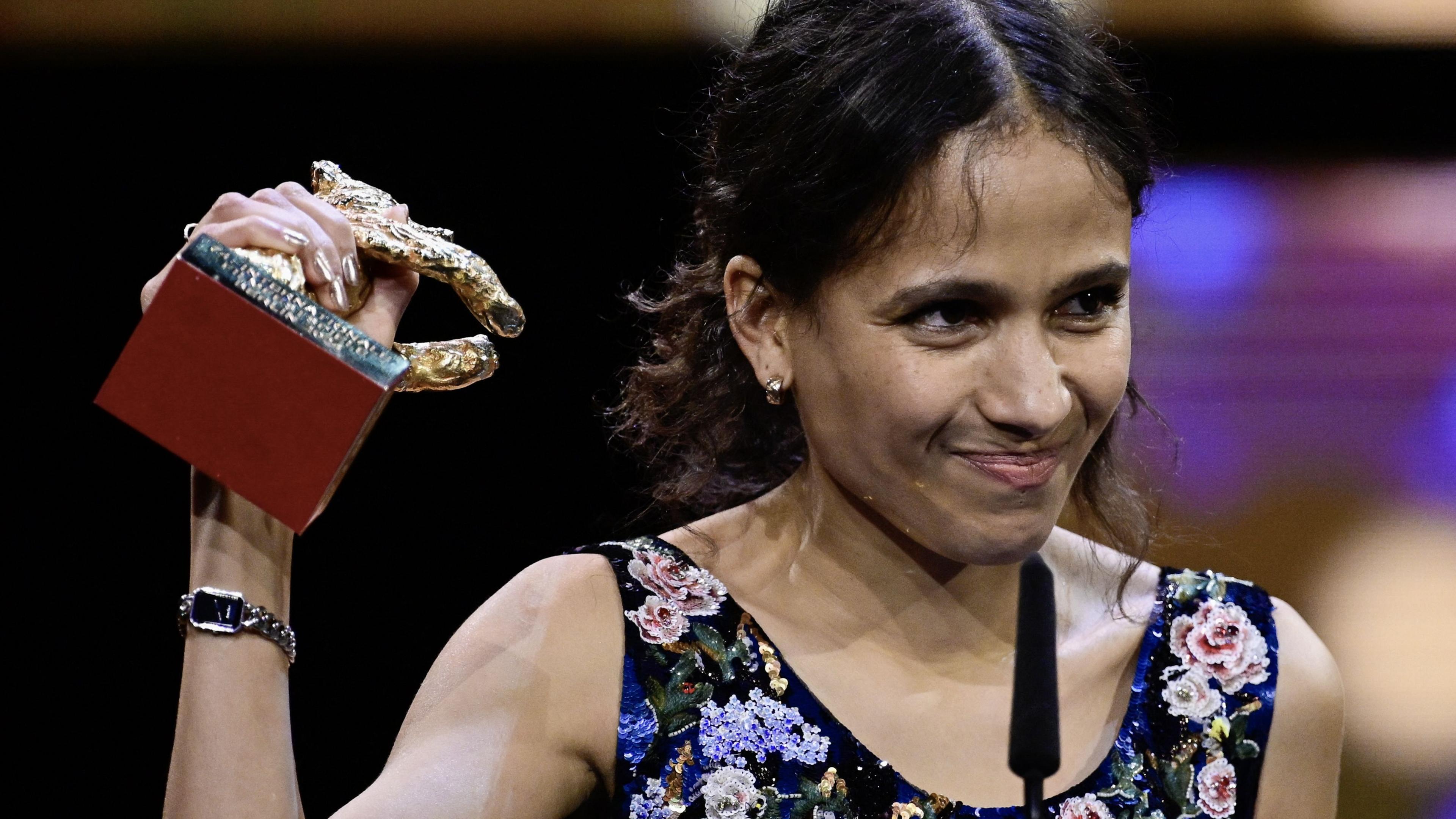 French-Senegalese filmmaker and actress Mati Diop celebrats with the Golden Bear for Best Film for the film "Dahomey" on stage during the awards ceremony of the 74th Berlinale International Film Festival, on February 24, 2024 in Berlin.
