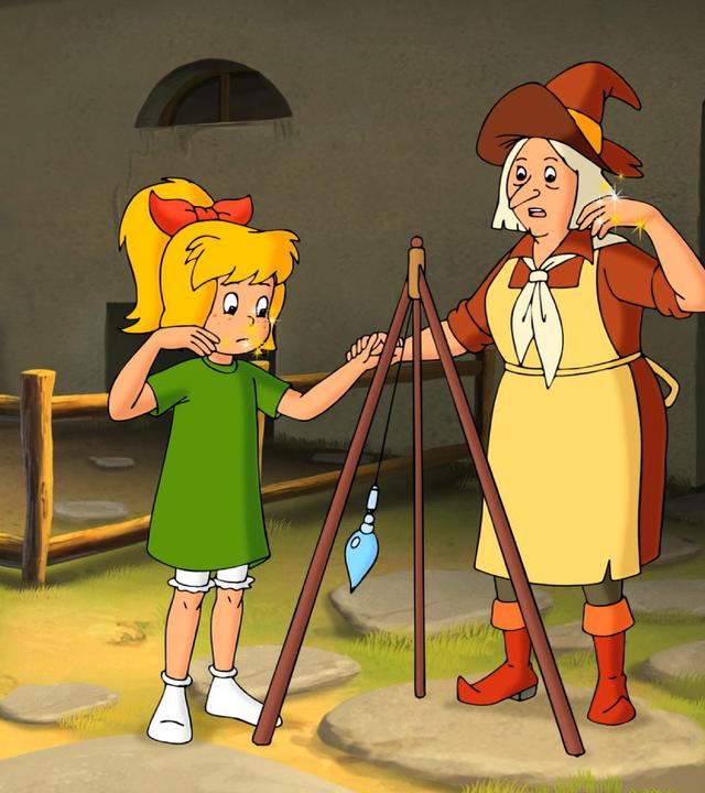 Bibi und Gundel betrachten das mystische Pendel.