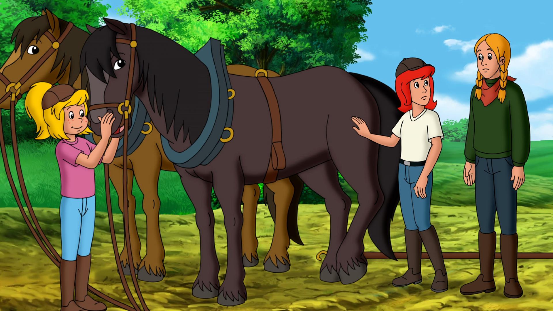 Bibi und Tina stehen mit ihren Pferden neben Linda.