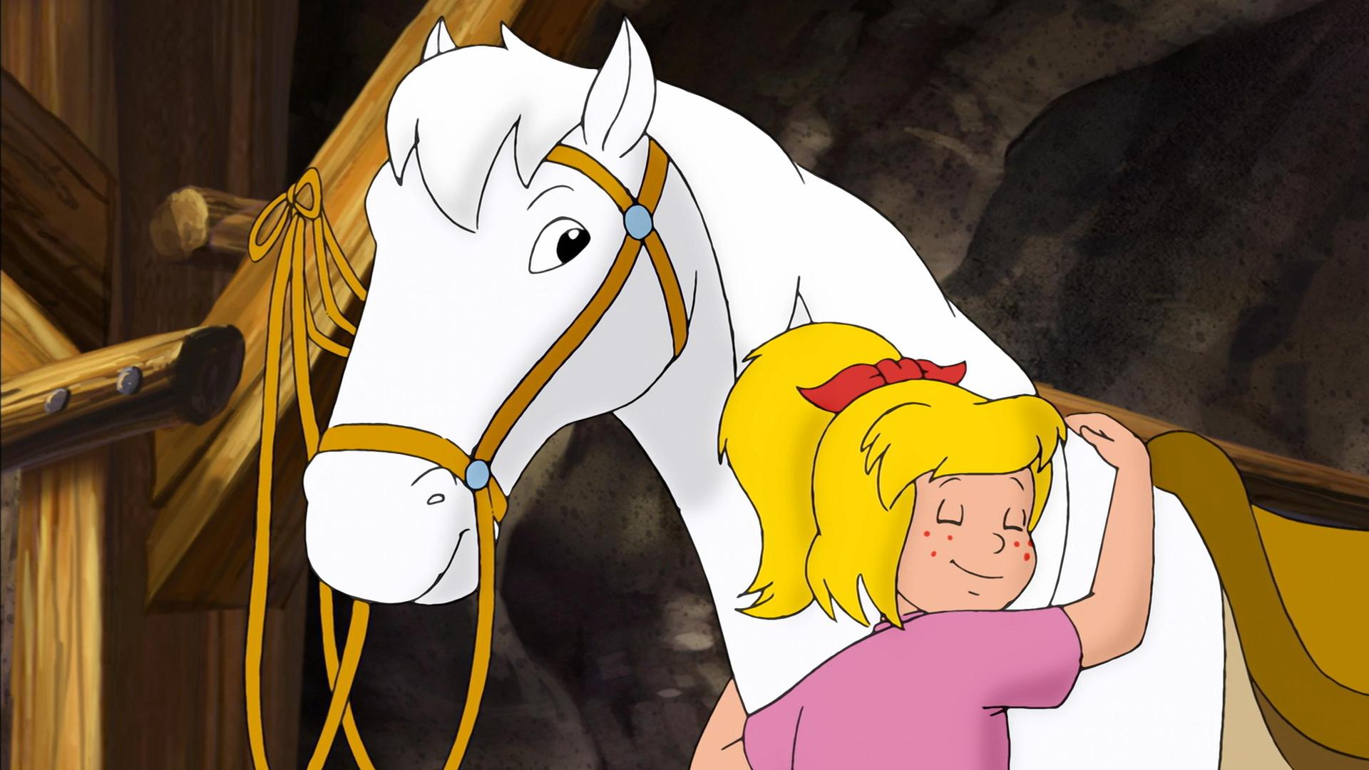 Bibi umarmt ihr Pferd Sabrina.