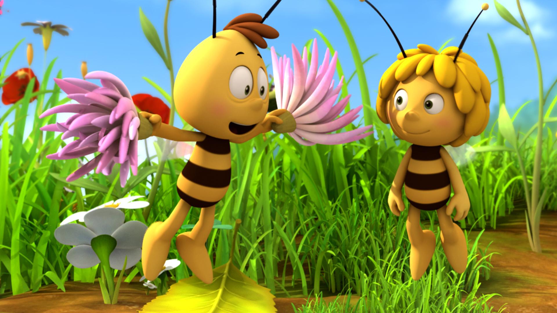 Willi ist ganz im Cheerleadermodus und nutzt Blütenblätter als Pompoms. Maja steht freudig daneben.