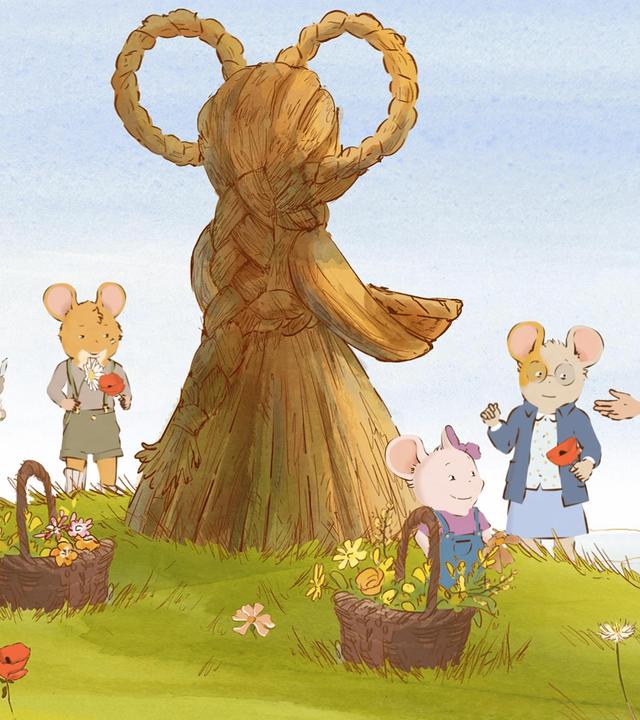 Auf einer schönen, grünen Wiese mit Blumen und Klatschmohn, steht eine schöne, sehr große, aus Stroh geformte Skulptur. Rund um diese Skulptur haben sich Marcelle mit ihren Töchtern, sowie Celestine und Augustin versammelt. Auf der Wiese stehen auch zwei Weidenkörbe mit gepflückten Blumen drin.