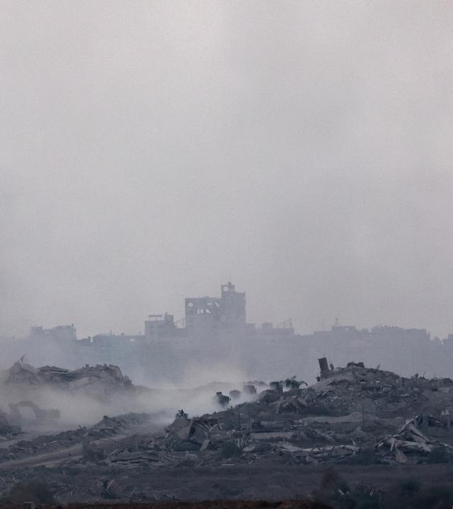 Smoke rises as a result of an Israeli airstrike on the outskirts of Gaza City, as seen from an undisclosed location on the Israeli side of the border, 15 September 2025
