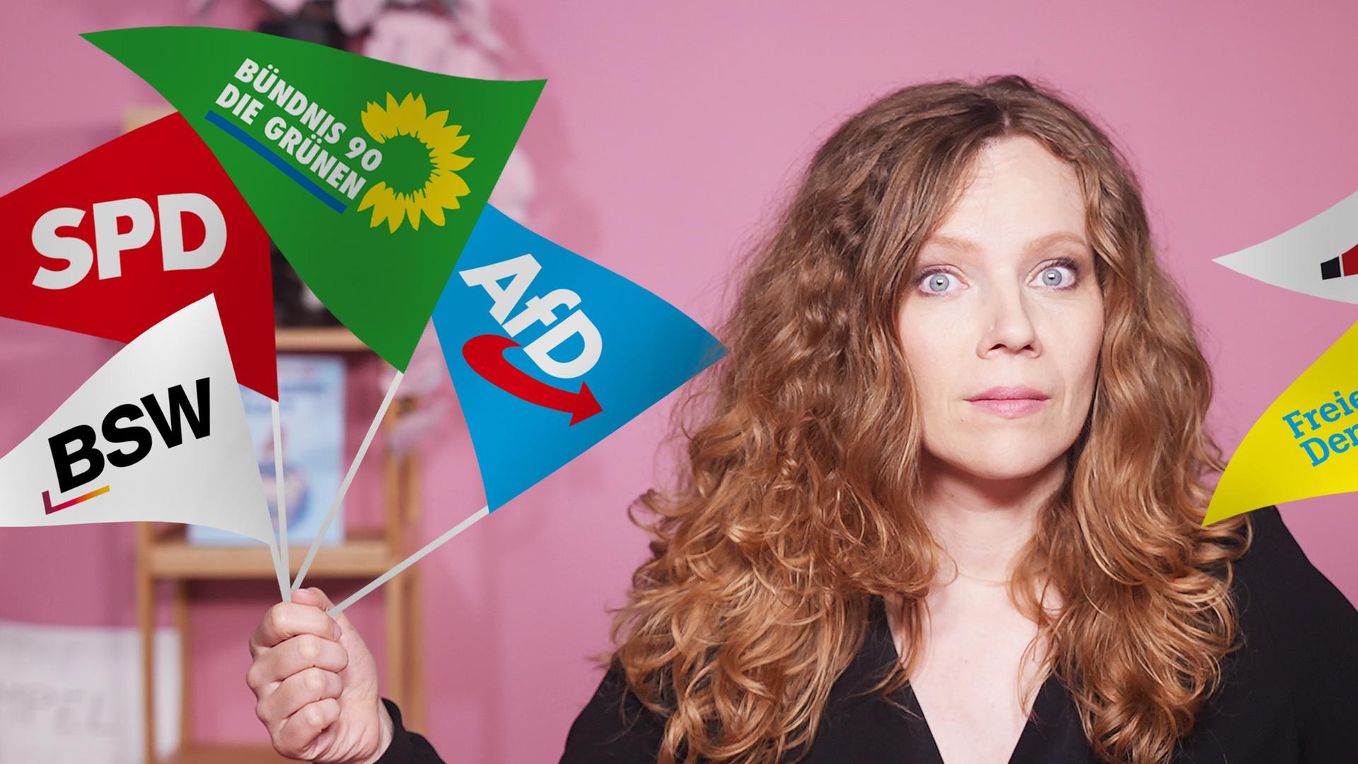 Sarah Bosetti befindet sich vor einem rosa Hintergrund. Sie hält in jeder Hand mehrere kleine Parteifahnen.