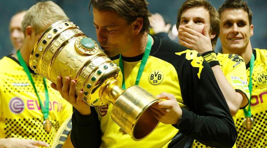 borussia dortmund's roman weidenfeller kisses the trophy after defeating bayern munich to win the german dfb cup (dfb pokal) final soccer match at the olympic stadium in berlin, may 12, 2012.    reuters/ina fassbender (germany  - tags: sport soccer) dfb rules prohibit use in mms services via handheld devices until two hours after a match and any usage on internet or online media simulating video footage during the match;dfb
