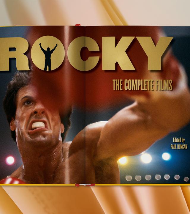 Auf den Seiten eines aufgeschlagenen Buches sieht man einen Boxer beim Boxkampf.