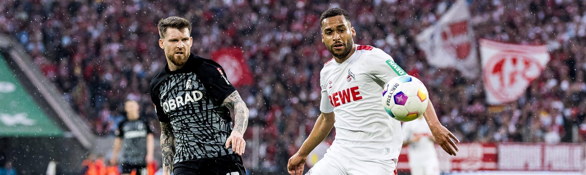 Zweikampf zwischen Lukas Kübler (SC Freiburg, 17) und Linton Maina (1. FC Köln, 37).