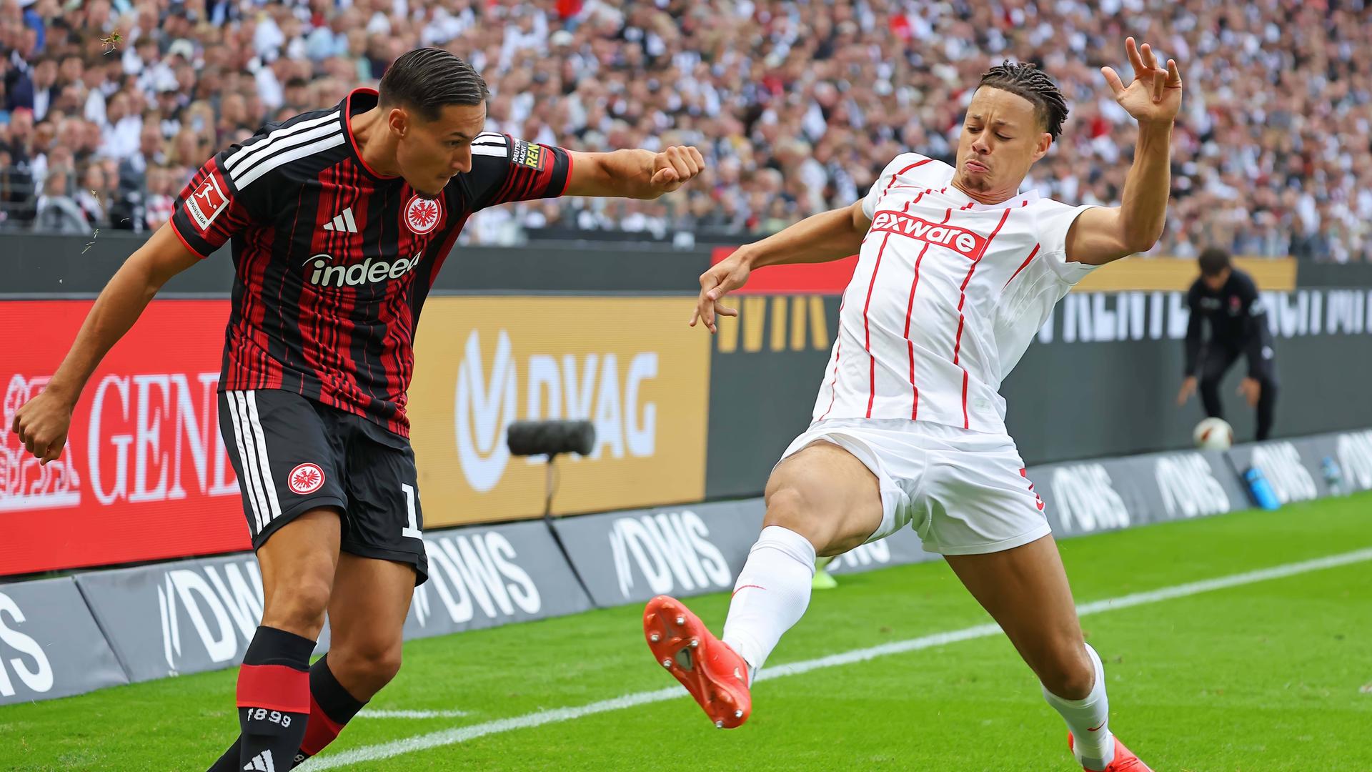 Younes Ebnoutalib (Frankfurt) gegen Derry Scherhant (SCF) im Zweikampf am 19.09.2026 in Frankfurt. 