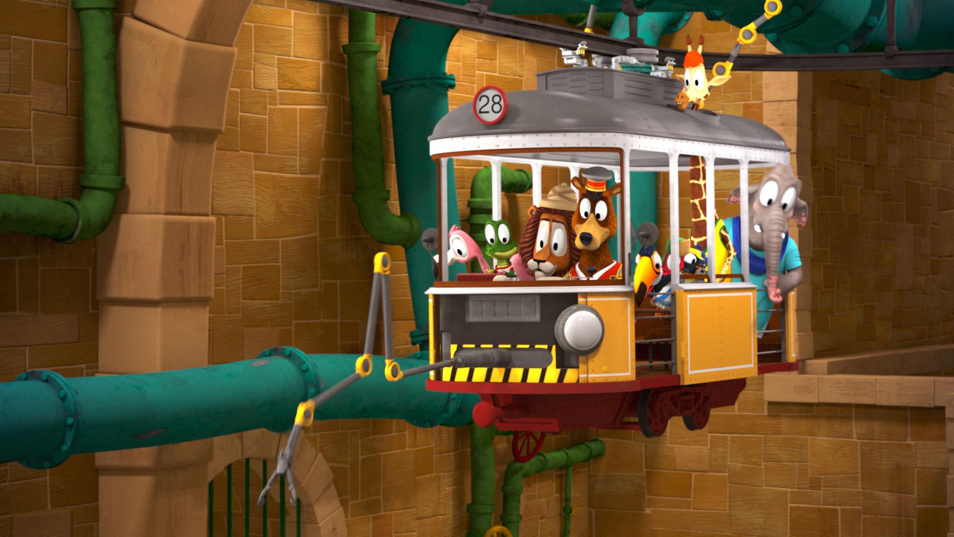 Die Zoobande sitzt in ihrem Bahnabteil und fährt durch ein Tunnelsystem. Ein mechansicher Greifarm, der vorne am Bahnabteil befestigt ist, greift nach etwas.