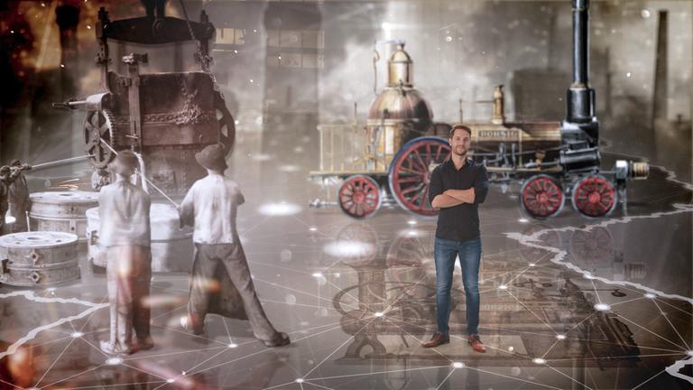 "Terra X: Deutschland in ... der Industriellen Revolution": Mirko Drotschmann steht vor einer Dampfmaschine.