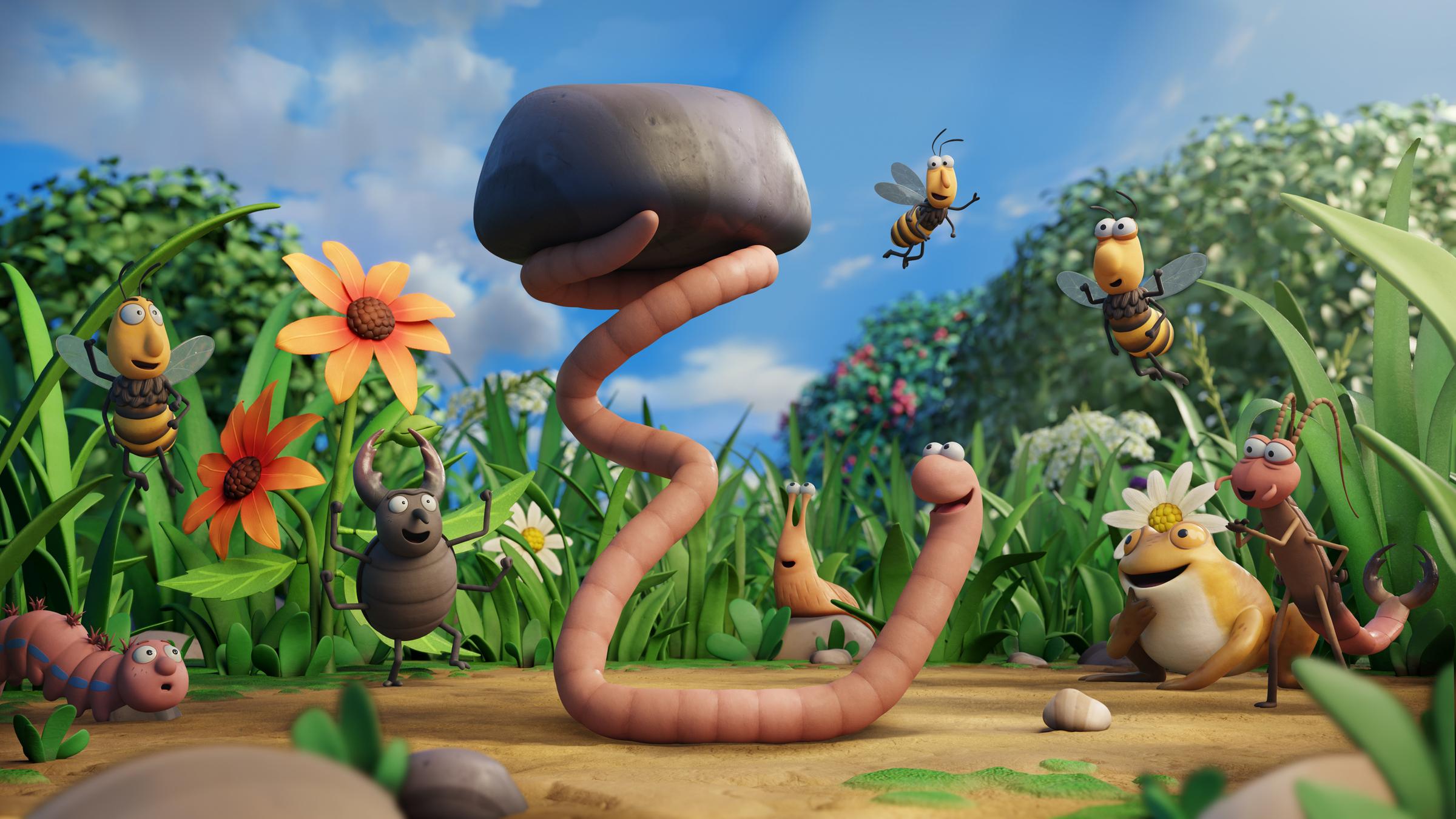 "Superwurm":  Mitten auf einer bunten Wiese, inmitten seiner Insektenfreunde befindet sich Superwurm. Er stemmt mit seinem Wurmschwanz einen Stein in die Höhe. Seine Freunde bestaunen dies mit offenem Mund und bewunderndem Blick.