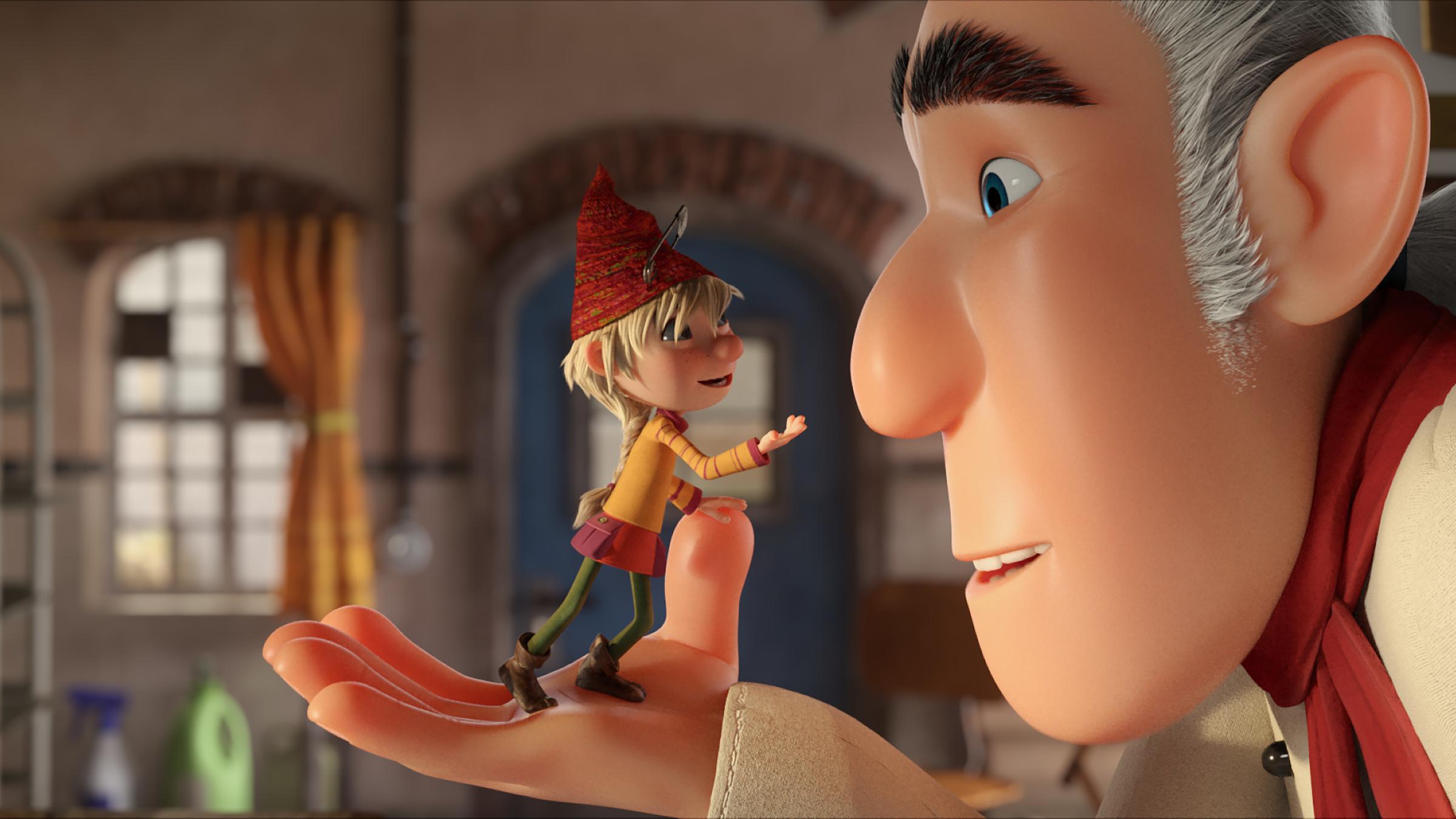 "Die Heinzels - Rückkehr der Heinzelmännchen": In der Backstube steht Heinzelmädchen Helvi auf der offenen Handfläche von Konditormeister Theo Hampus. Ganz nah an sein Gesicht ist sie herangerückt, hält sich an seinem Daumen fest und spricht zu ihm. Theo sieht sie mit großen Augen an.