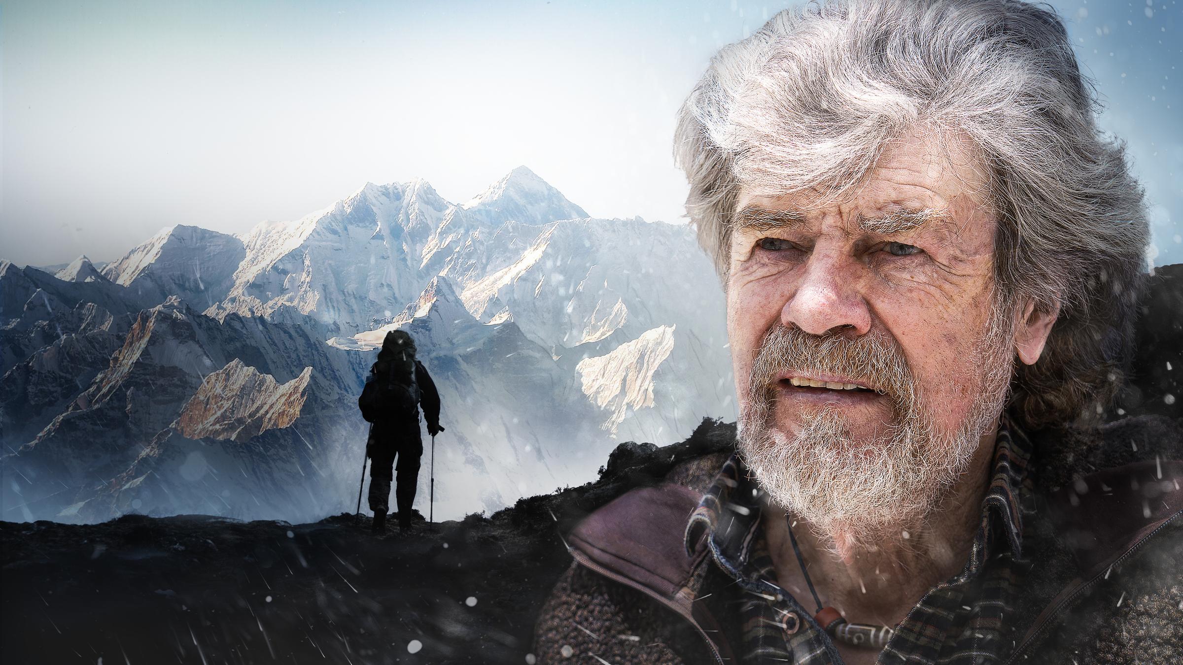 "ZDFzeit: Mensch Messner! - Leben am Limit": Reinhold Messner mit grauem Haar und Bart. Er schaut in die Ferne. Hinter ihm ist ein Gebirgsmassiv zu sehen.