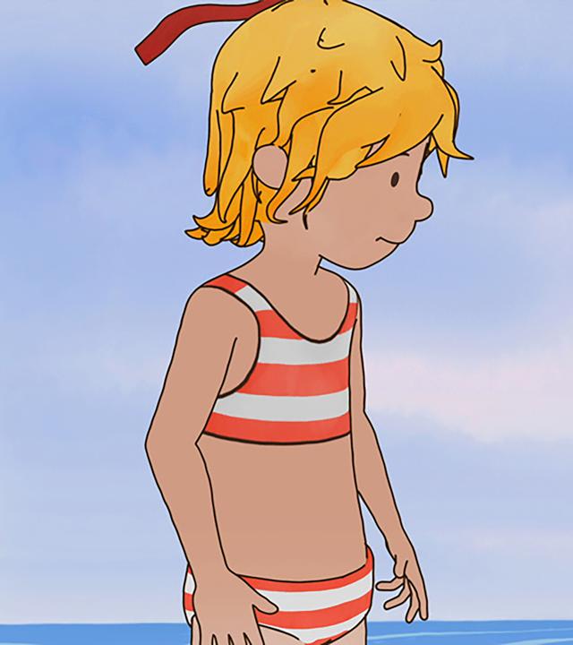 Conni (links) und Jakob (rechts) haben am Strand eine Muschel gefunden.