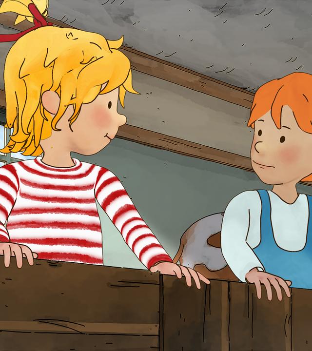 Conni mit Annika im Kuhstall auf dem Bauernhof.