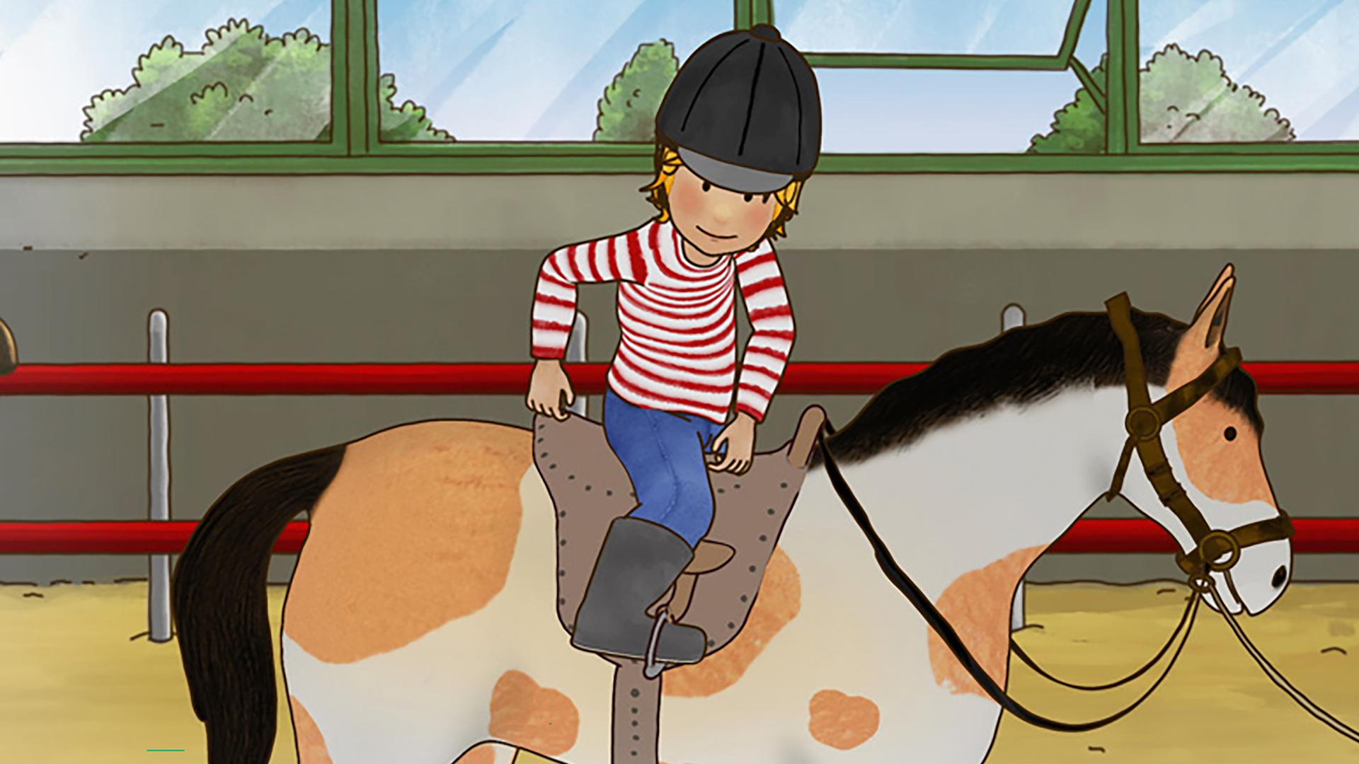 Conni sitzt auf einem Pferd und prüft ihre Haltung.