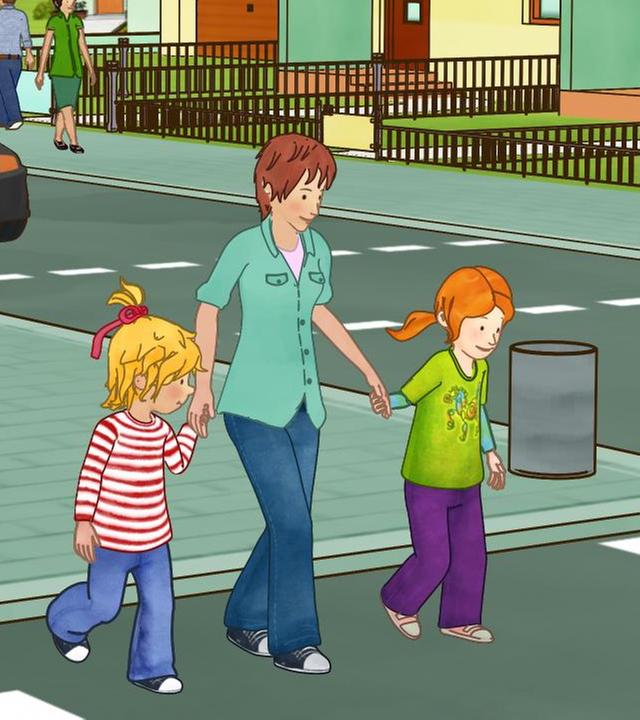 Conni überquert mit Mama und Anna bei Grün die Straße.