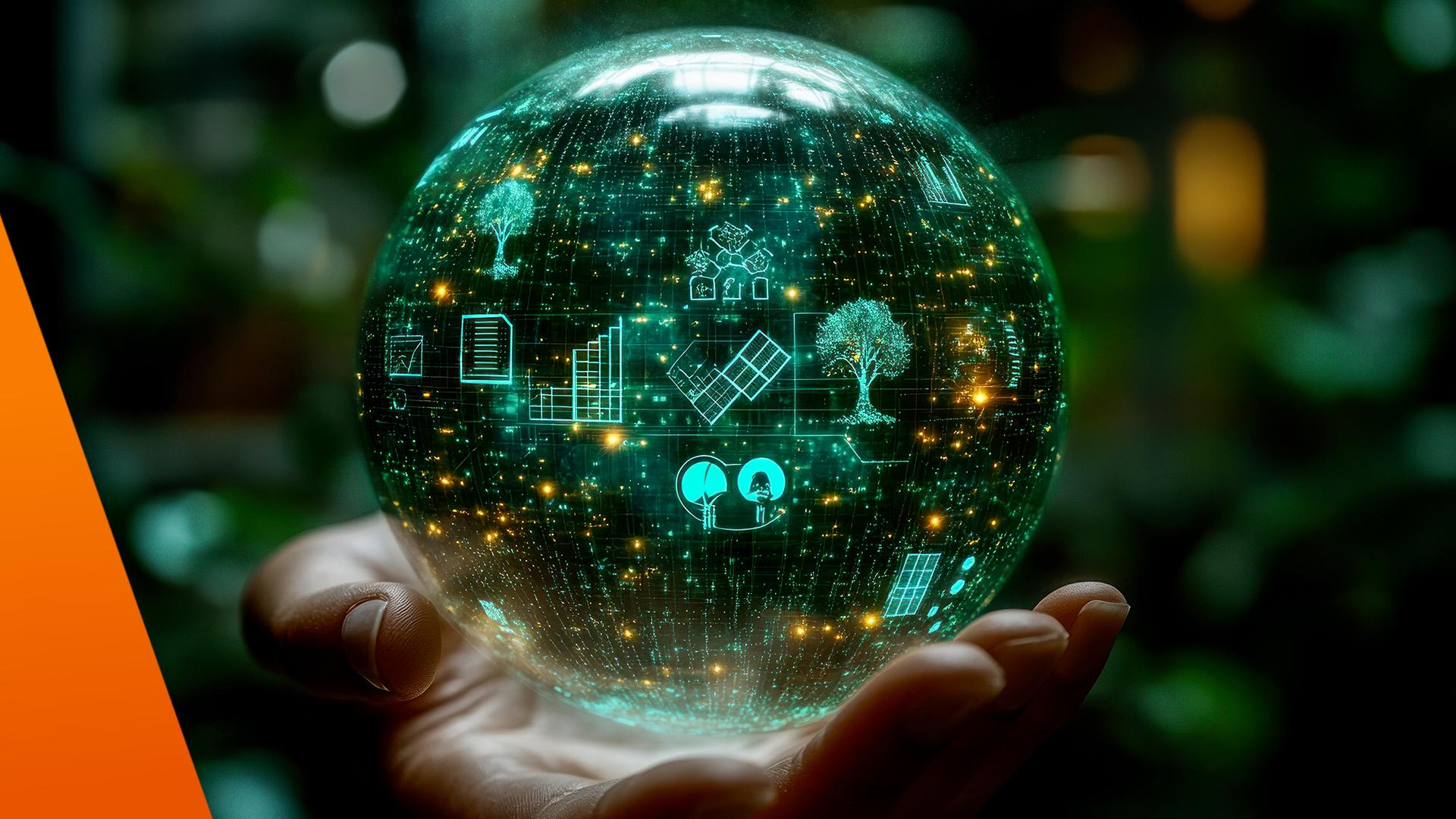 Hand hält eine grüne Erdkugel 