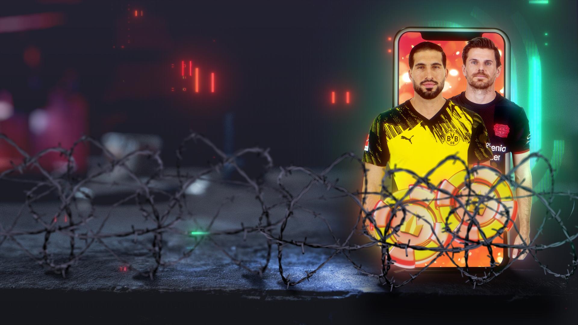 Zwei Bundesligaspieler sind auf einem Handy zu sehen, davor Drahtzaun.