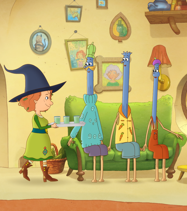 Die Apfelmännchen sind ganz blau und sitzen auf dem Sofa. Petronella serviert ihnen eine Getränk.