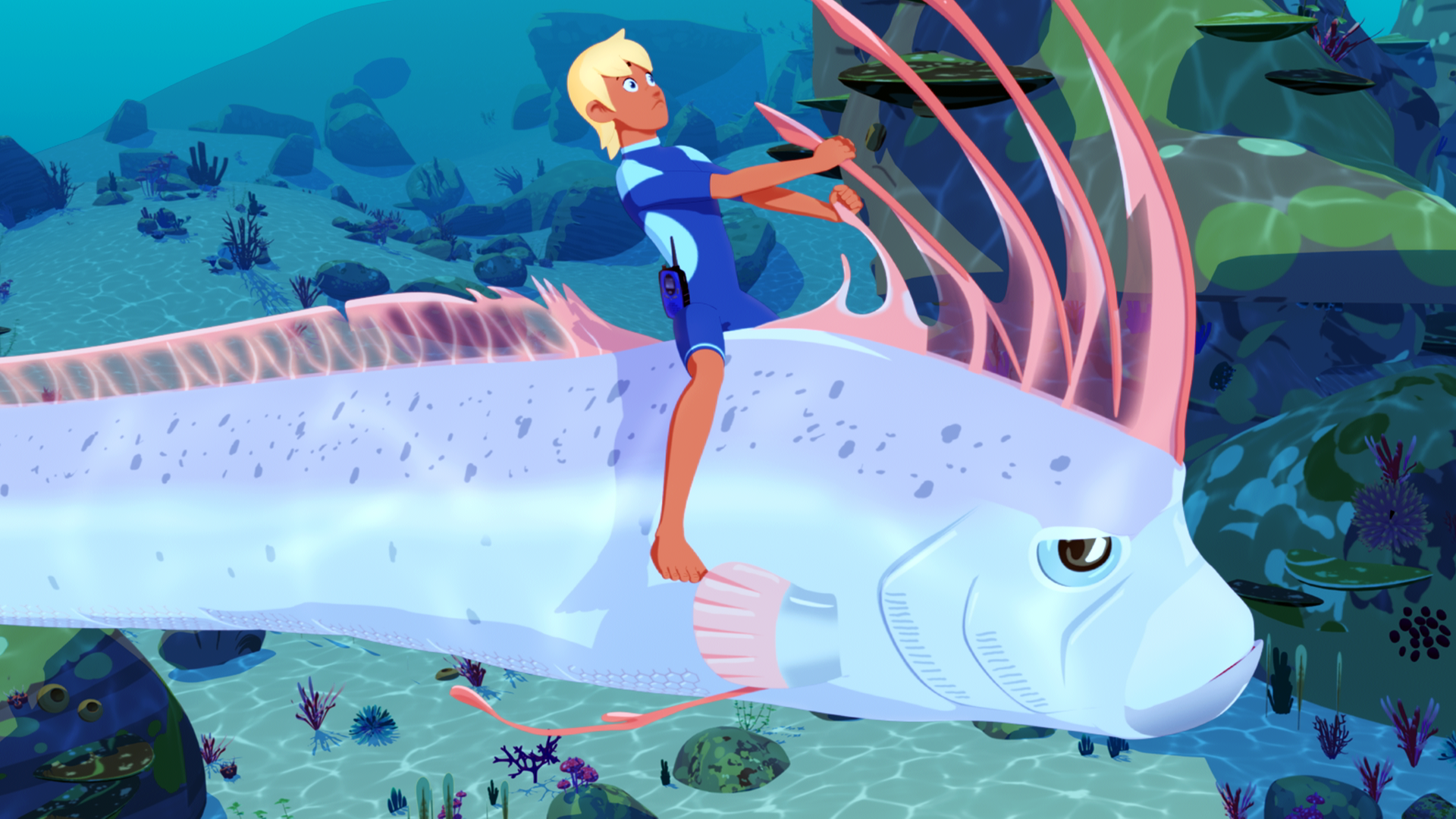 Yann klammert sich an einer Rückenflosse des aalförmigen Seeungeuers fest.