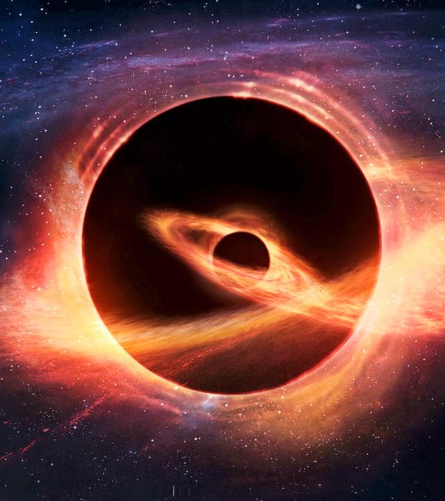Computeranimation. Ein großes Schwarzes Loch im Universum verschlingt ein kleineres Schwarzes Loch. Um beide drehen sich rote Lichtkreise.