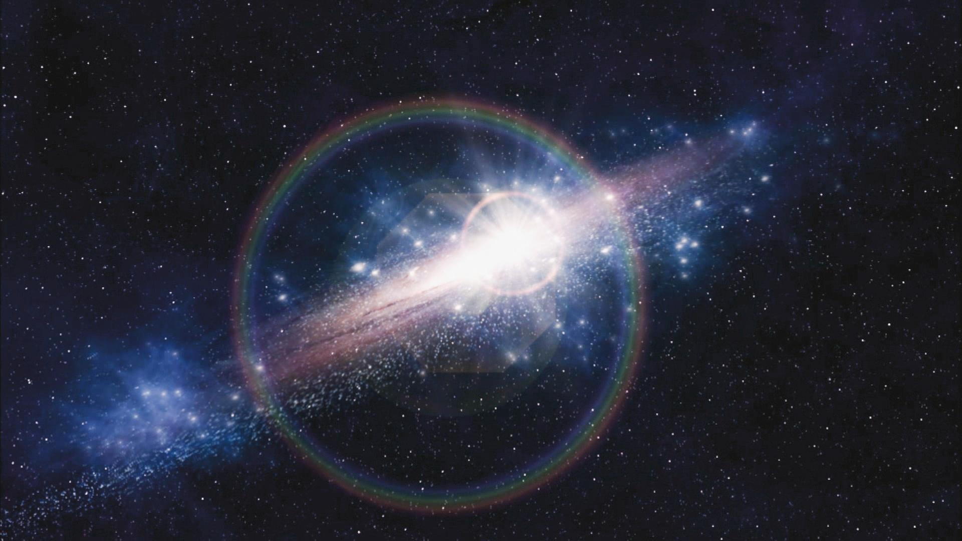  Computergrafik. Im Weltraum ist eine ellipsenförmige Galaxie zu sehen, die hell strahlt.